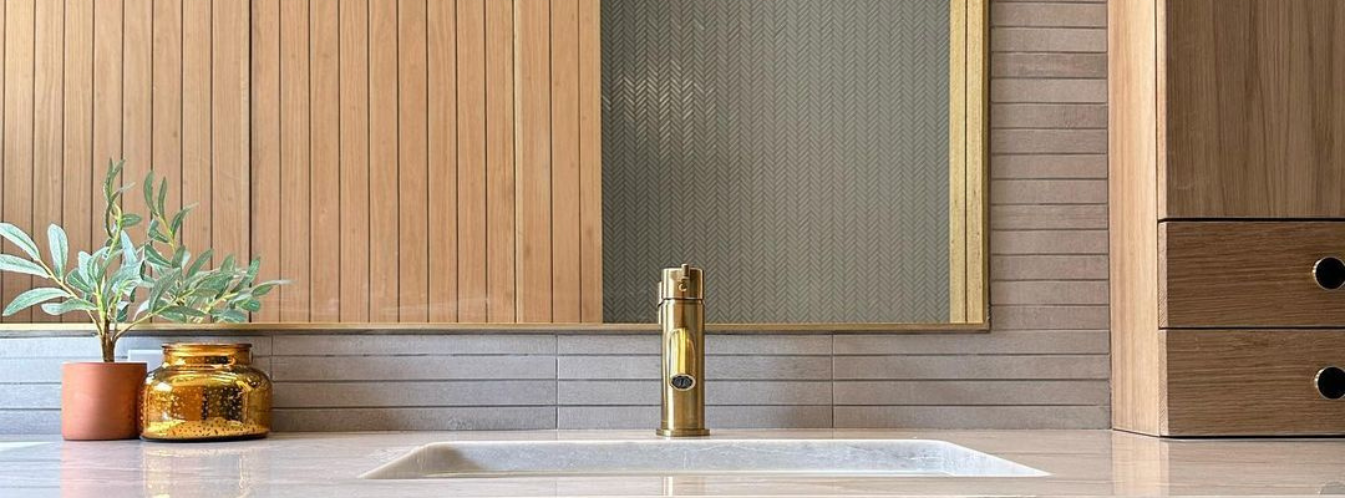 photo credit: @smolendesignco brushed brass bathroom faucet