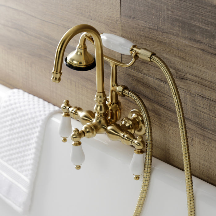 Kingston Heirloom AE11T7 - Aqua Vintage Three-Handle 2-Hole Tub Wall Mount Clawfoot Tub Faucet with Hand Shower, Brushed Brass