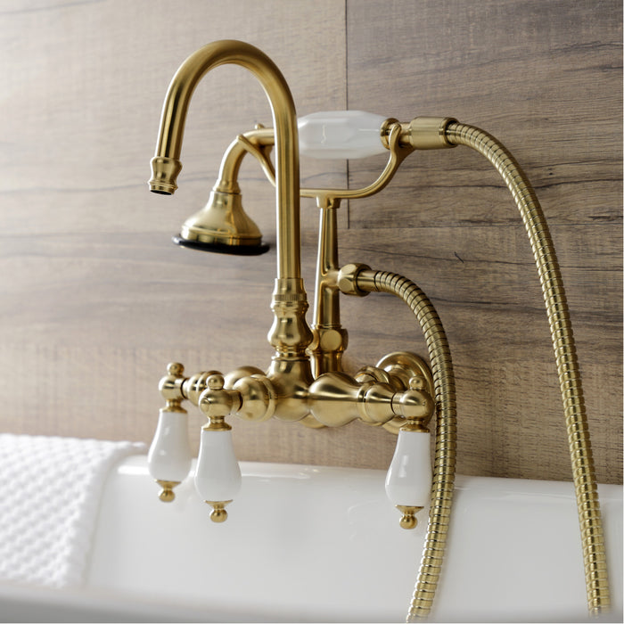 Kingston Heirloom AE11T7 - Aqua Vintage Three-Handle 2-Hole Tub Wall Mount Clawfoot Tub Faucet with Hand Shower, Brushed Brass