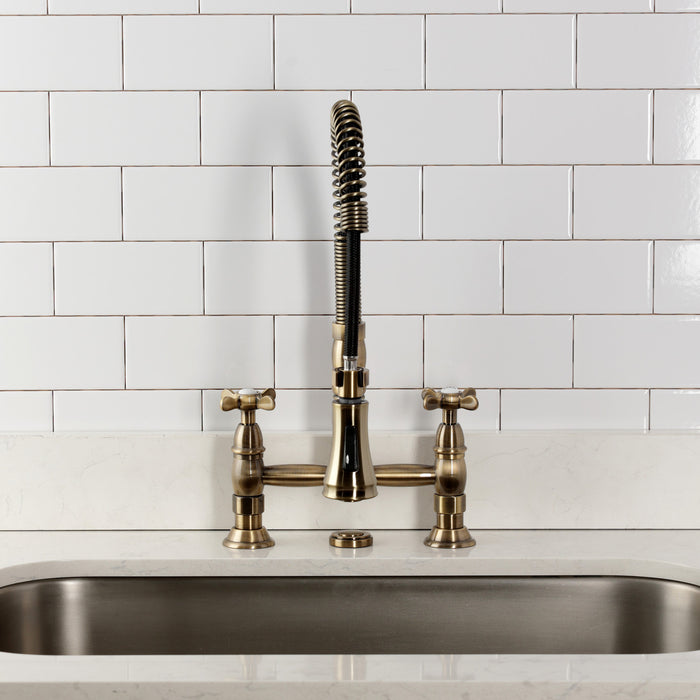 Kingston Tulare GS1273BEX - Essex Double-Handle 2-Hole Deck-Mount Pre-Rinse Bridge Kitchen Faucet, Antique Brass