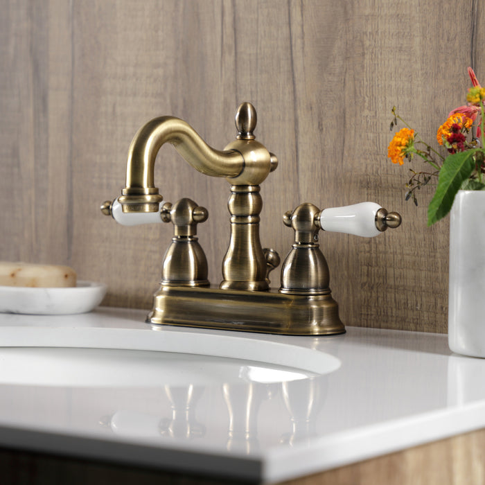 Kingston Heirloom KB1603PL - Heritage Double-Handle 3-Hole Deck Mount 4-Inch Centerset Bathroom Faucet with Pop-Up Drain, Antique Brass