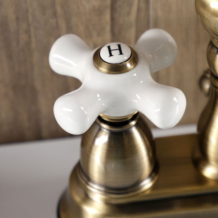 Kingston Heirloom KB1603PX - Heritage Double-Handle 3-Hole Deck Mount 4-Inch Centerset Bathroom Faucet with Pop-Up Drain, Antique Brass
