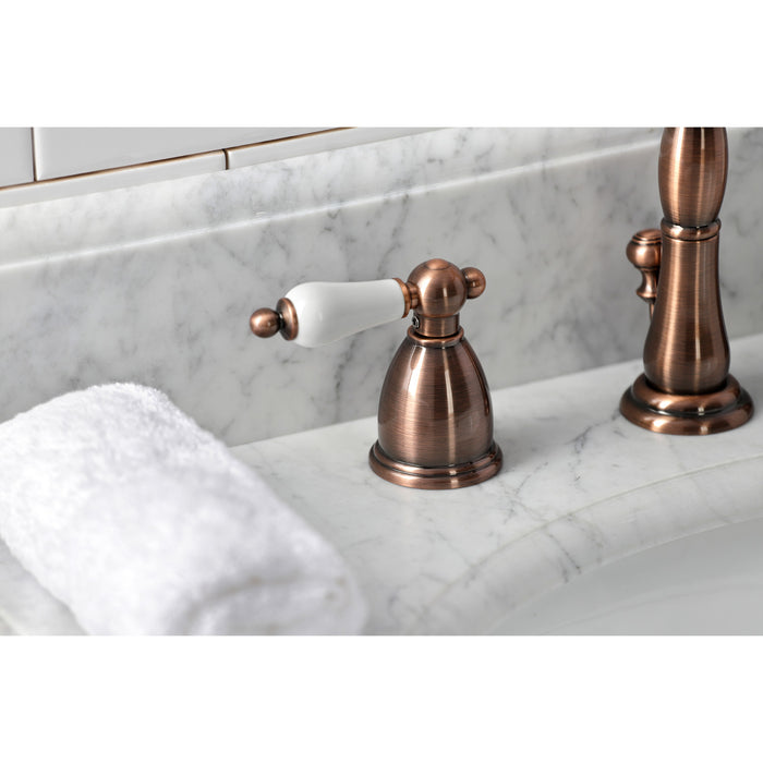 Kingston Heirloom KB197PLAC - Heritage Two-Handle 3-Hole Deck Mount Widespread Bathroom Faucet with Brass Pop-Up, Antique Copper