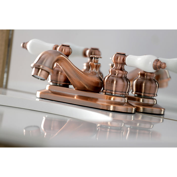 Kingston Heirloom KB606PL - Restoration Double-Handle 3-Hole Deck Mount 4-Inch Centerset Bathroom Faucet with Pop-Up Drain, Antique Copper