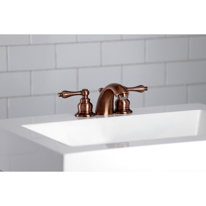 Kingston Heirloom KB946AL - Victorian Two-Handle 3-Hole Deck Mount Mini-Widespread Bathroom Faucet with Pop-Up Drain, Antique Copper