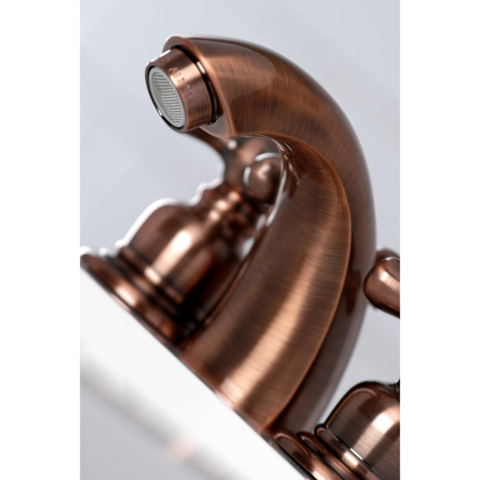 Kingston Heirloom KB946AX - Victorian Two-Handle 3-Hole Deck Mount Mini-Widespread Bathroom Faucet with Pop-Up Drain, Antique Copper