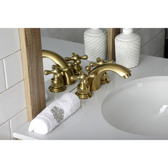 Kingston Heirloom KB947AXSB - Victorian Two-Handle 3-Hole Deck Mount Mini-Widespread Bathroom Faucet with Pop-Up Drain, Brushed Brass
