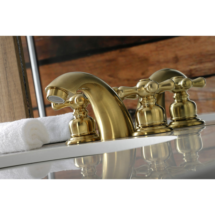 Kingston Heirloom KB947AXSB - Victorian Two-Handle 3-Hole Deck Mount Mini-Widespread Bathroom Faucet with Pop-Up Drain, Brushed Brass