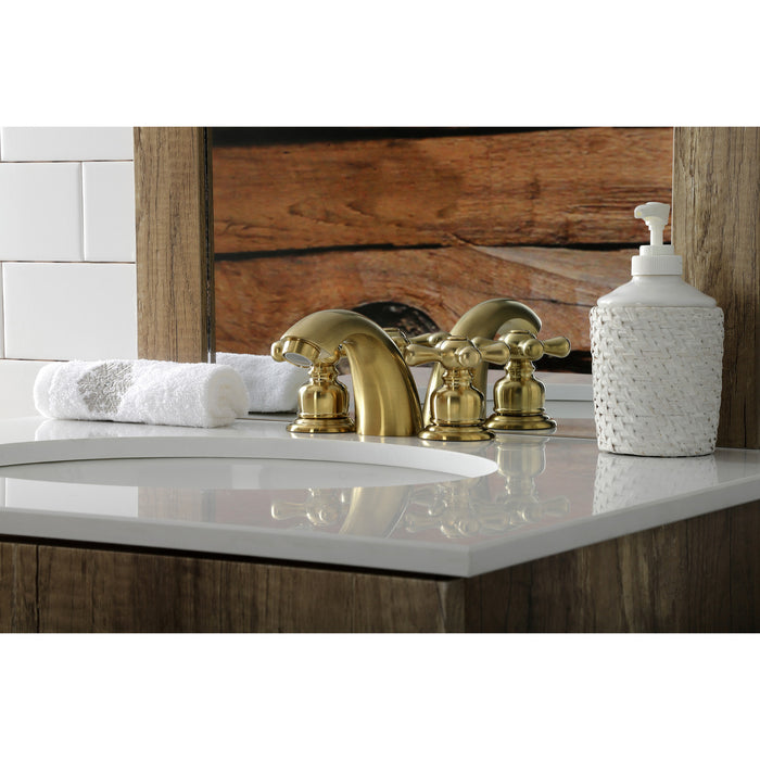 Kingston Heirloom KB947AXSB - Victorian Two-Handle 3-Hole Deck Mount Mini-Widespread Bathroom Faucet with Pop-Up Drain, Brushed Brass