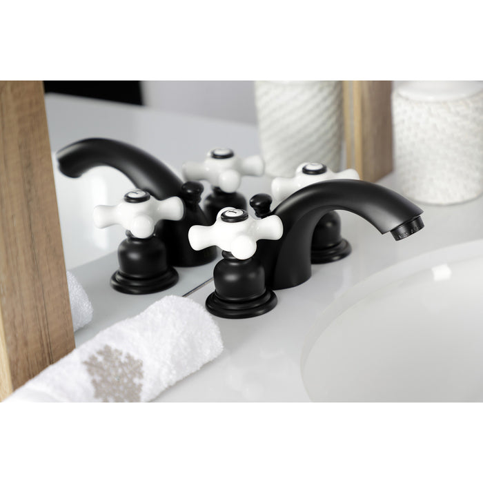 Kingston Heirloom KB950PX - Victorian Two-Handle 3-Hole Deck Mount Mini-Widespread Bathroom Faucet with Pop-Up Drain, Matte Black