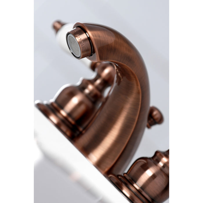 Kingston Heirloom KB956PL - Victorian Two-Handle 3-Hole Deck Mount Mini-Widespread Bathroom Faucet with Pop-Up Drain, Antique Copper