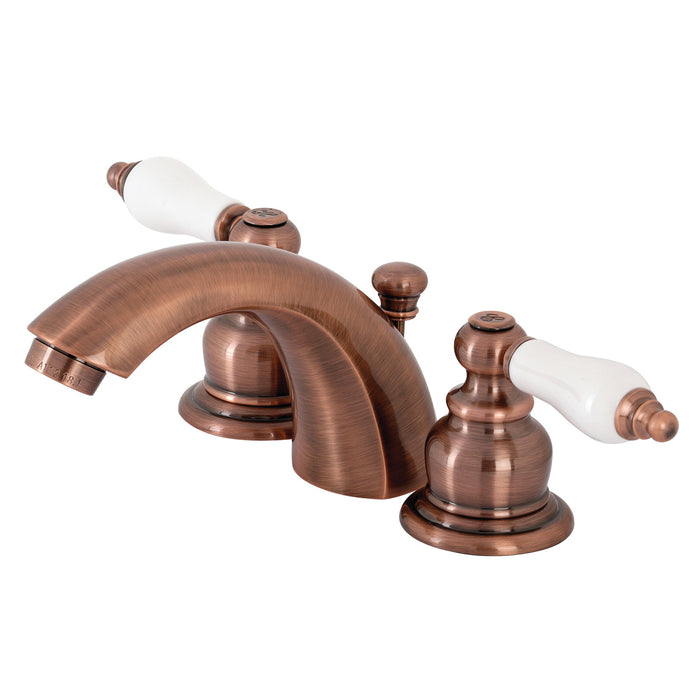 Kingston Heirloom KB956PL - Victorian Two-Handle 3-Hole Deck Mount Mini-Widespread Bathroom Faucet with Pop-Up Drain, Antique Copper
