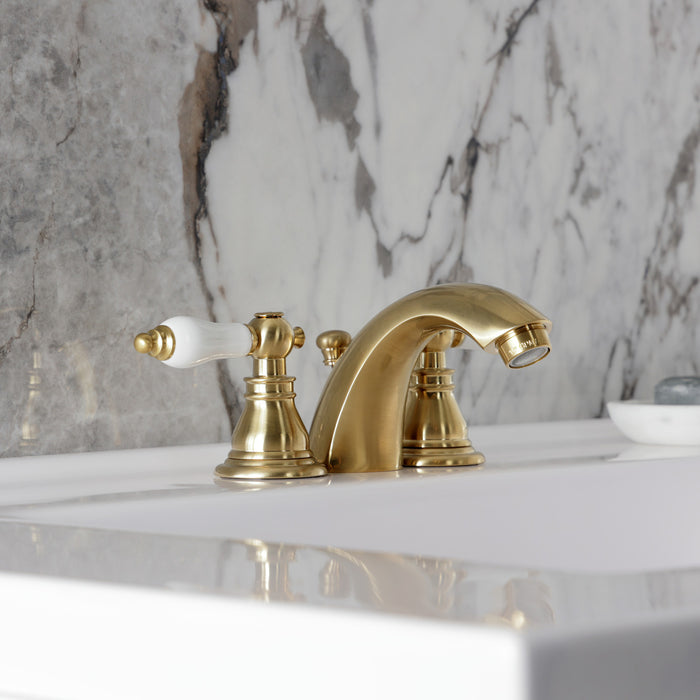 Kingston Tulare KB957APLSB - American Patriot Two-Handle 3-Hole Deck Mount Mini-Widespread Bathroom Faucet with Pop-Up Drain, Brushed Brass