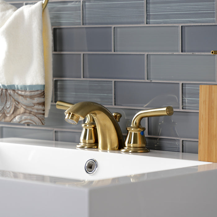 Kingston Tulare KB957RXLSB - Restoration Two-Handle 3-Hole Deck Mount Mini-Widespread Bathroom Faucet with Pop-Up Drain, Brushed Brass