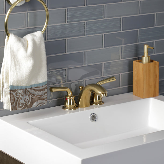 Kingston Tulare KB957RXLSB - Restoration Two-Handle 3-Hole Deck Mount Mini-Widespread Bathroom Faucet with Pop-Up Drain, Brushed Brass