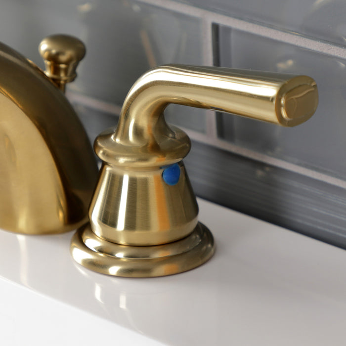 Kingston Tulare KB957RXLSB - Restoration Two-Handle 3-Hole Deck Mount Mini-Widespread Bathroom Faucet with Pop-Up Drain, Brushed Brass