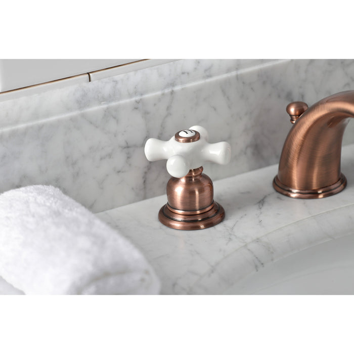 Kingston Heirloom KB966PX - Magellan Two-Handle 3-Hole Deck Mount Widespread Bathroom Faucet with Pop-Up Drain, Antique Copper