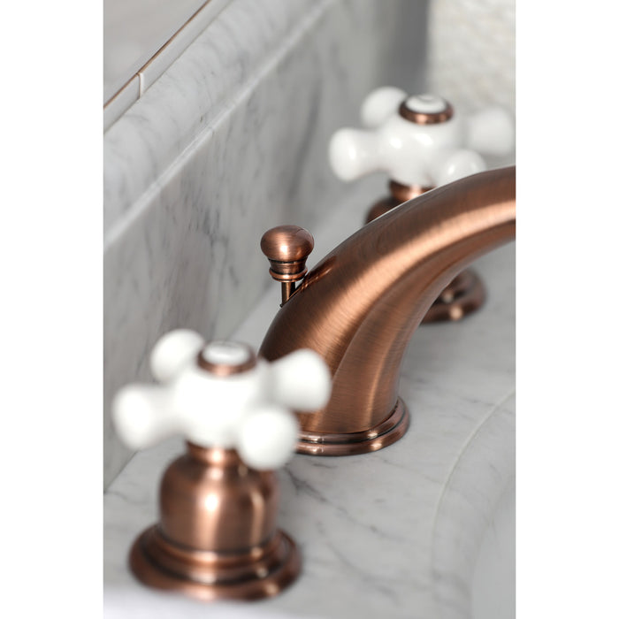 Kingston Heirloom KB966PX - Magellan Two-Handle 3-Hole Deck Mount Widespread Bathroom Faucet with Pop-Up Drain, Antique Copper