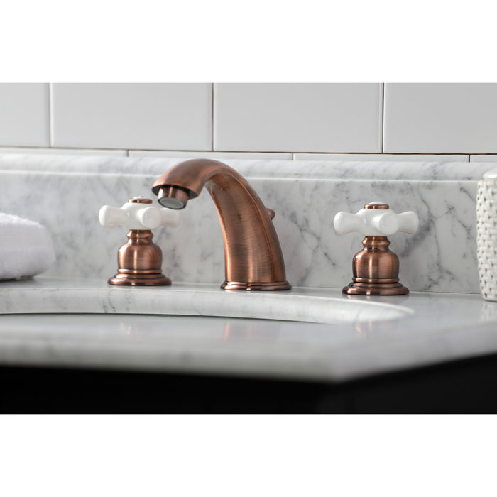 Kingston Heirloom KB966PX - Magellan Two-Handle 3-Hole Deck Mount Widespread Bathroom Faucet with Pop-Up Drain, Antique Copper