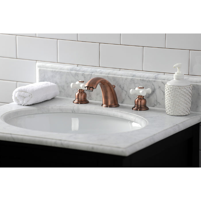 Kingston Heirloom KB966PX - Magellan Two-Handle 3-Hole Deck Mount Widespread Bathroom Faucet with Pop-Up Drain, Antique Copper