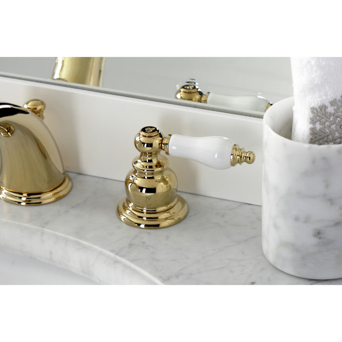 Kingston Heirloom KB972PLB - Victorian Two-Handle 3-Hole Deck Mount Widespread Bathroom Faucet with Brass Pop-Up, Polished Brass