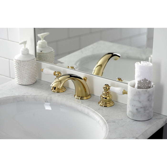 Kingston Heirloom KB972PLB - Victorian Two-Handle 3-Hole Deck Mount Widespread Bathroom Faucet with Brass Pop-Up, Polished Brass