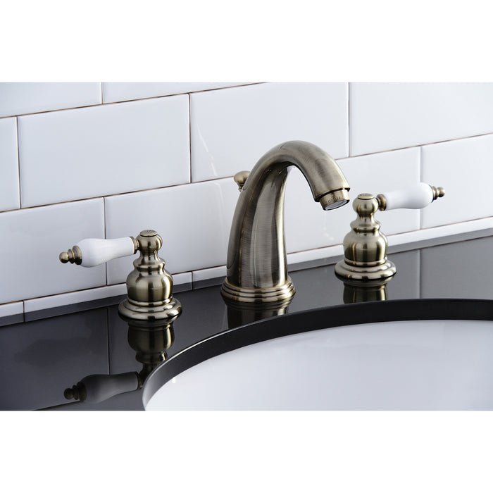 Kingston Heirloom KB983PLAB - Victorian Two-Handle 3-Hole Deck Mount Widespread Bathroom Faucet with Pop-Up Drain, Antique Brass