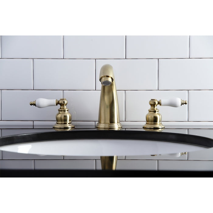 Kingston Heirloom KB987PLSB - Victorian Two-Handle 3-Hole Deck Mount Widespread Bathroom Faucet with Pop-Up Drain, Brushed Brass
