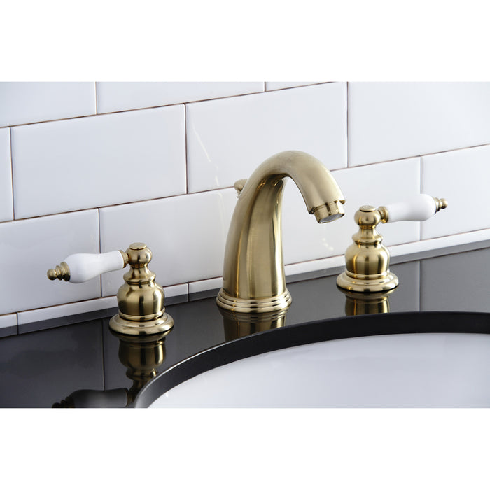 Kingston Heirloom KB987PLSB - Victorian Two-Handle 3-Hole Deck Mount Widespread Bathroom Faucet with Pop-Up Drain, Brushed Brass