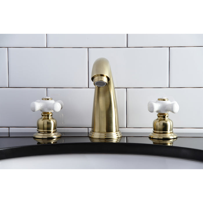 Kingston Heirloom KB987PXSB - Victorian Two-Handle 3-Hole Deck Mount Widespread Bathroom Faucet with Pop-Up Drain, Brushed Brass