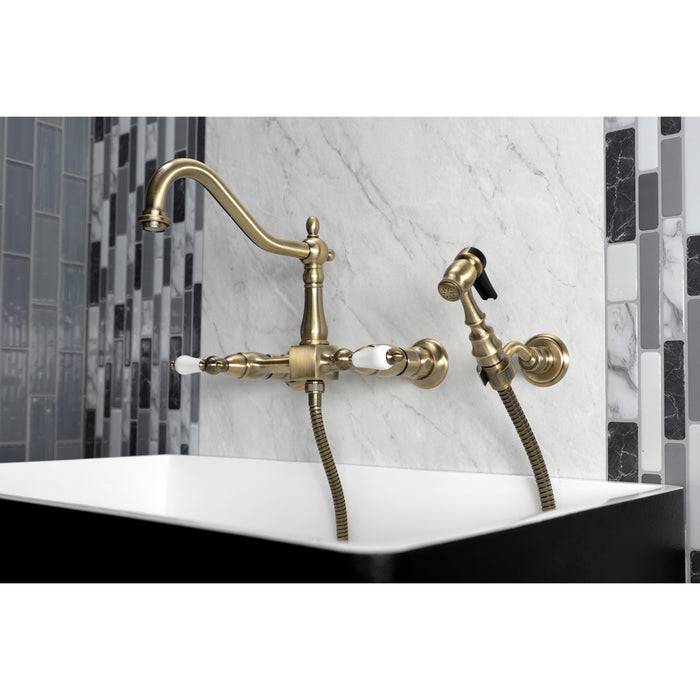 Kingston Heirloom KS1243PLBS - Heritage Two-Handle 3-Hole Wall Mount Bridge Kitchen Faucet with Brass Sprayer, Antique Brass