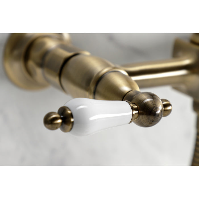 Kingston Heirloom KS1243PLBS - Heritage Two-Handle 3-Hole Wall Mount Bridge Kitchen Faucet with Brass Sprayer, Antique Brass