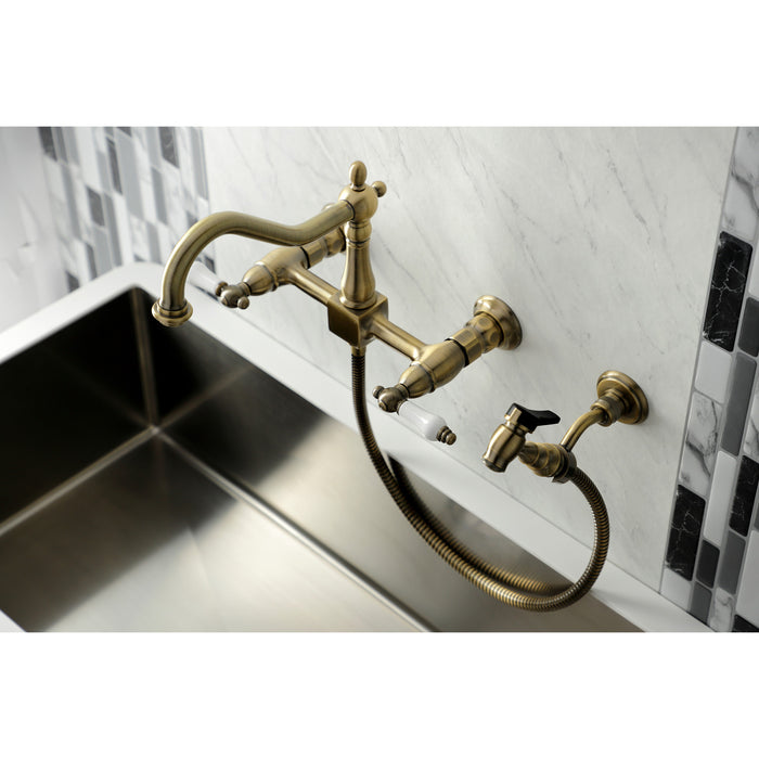 Kingston Heirloom KS1243PLBS - Heritage Two-Handle 3-Hole Wall Mount Bridge Kitchen Faucet with Brass Sprayer, Antique Brass