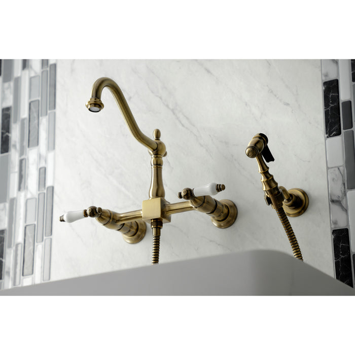 Kingston Heirloom KS1243PLBS - Heritage Two-Handle 3-Hole Wall Mount Bridge Kitchen Faucet with Brass Sprayer, Antique Brass