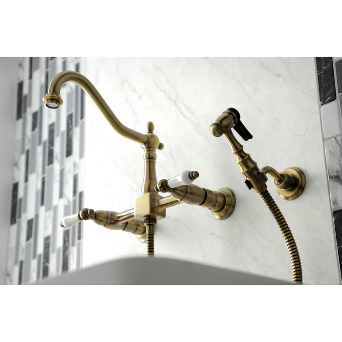 Kingston Heirloom KS1243PLBS - Heritage Two-Handle 3-Hole Wall Mount Bridge Kitchen Faucet with Brass Sprayer, Antique Brass