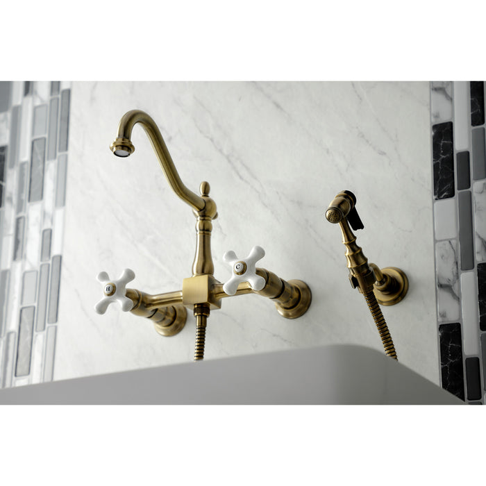 Kingston Heirloom KS1243PXBS - Heritage Two-Handle 3-Hole Wall Mount Bridge Kitchen Faucet with Brass Sprayer, Antique Brass