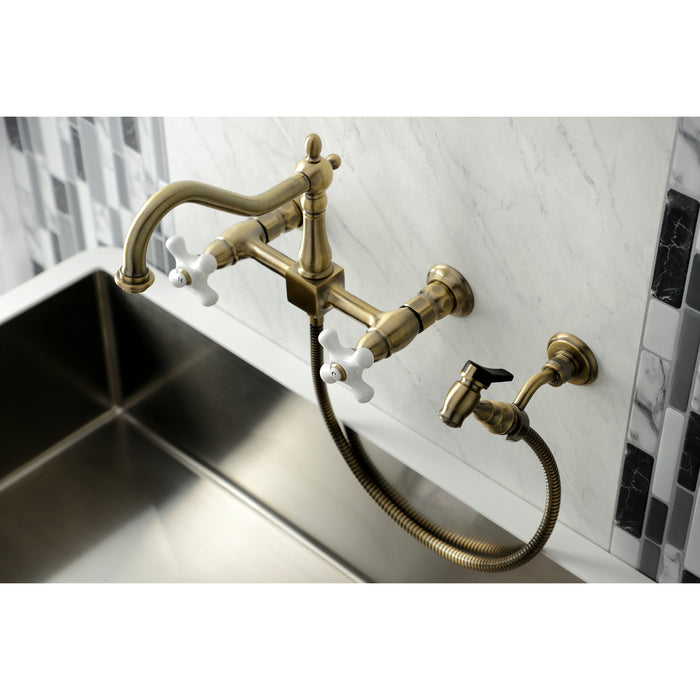Kingston Heirloom KS1243PXBS - Heritage Two-Handle 3-Hole Wall Mount Bridge Kitchen Faucet with Brass Sprayer, Antique Brass