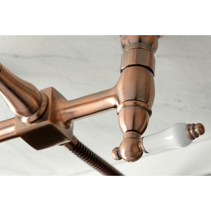 Kingston Heirloom KS124PLBSAC - Heritage Two-Handle 3-Hole Wall Mount Bridge Kitchen Faucet with Brass Sprayer, Antique Copper