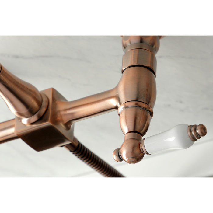 Heritage KS124PLBSAC Two-Handle 2-Hole Wall Mount Bridge Kitchen Faucet with Brass Sprayer, Antique Copper