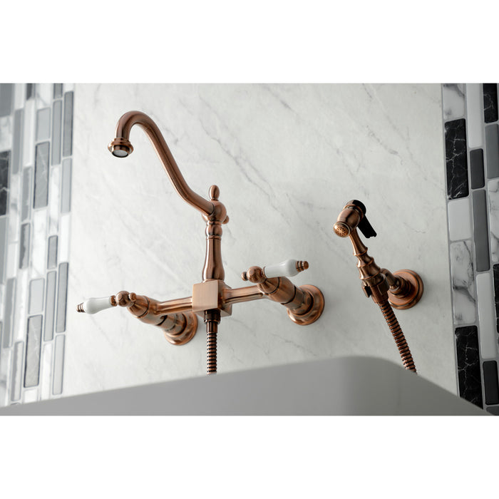 Kingston Heirloom KS124PLBSAC - Heritage Two-Handle 3-Hole Wall Mount Bridge Kitchen Faucet with Brass Sprayer, Antique Copper