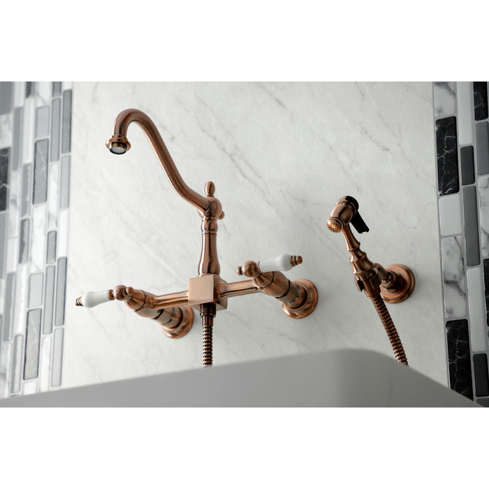 Heritage KS124PLBSAC Two-Handle 2-Hole Wall Mount Bridge Kitchen Faucet with Brass Sprayer, Antique Copper