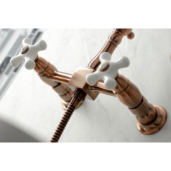 Kingston Heirloom KS124PXBSAC - Heritage Two-Handle 3-Hole Wall Mount Bridge Kitchen Faucet with Brass Sprayer, Antique Copper