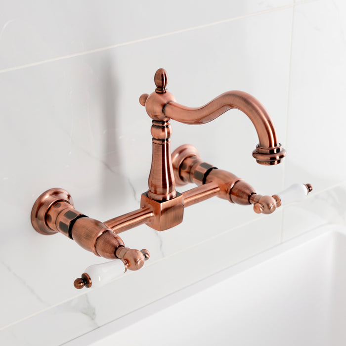 Kingston Heirloom KS126PLAC - Heritage Two-Handle 2-Hole Wall Mount Bridge Kitchen Faucet, Antique Copper