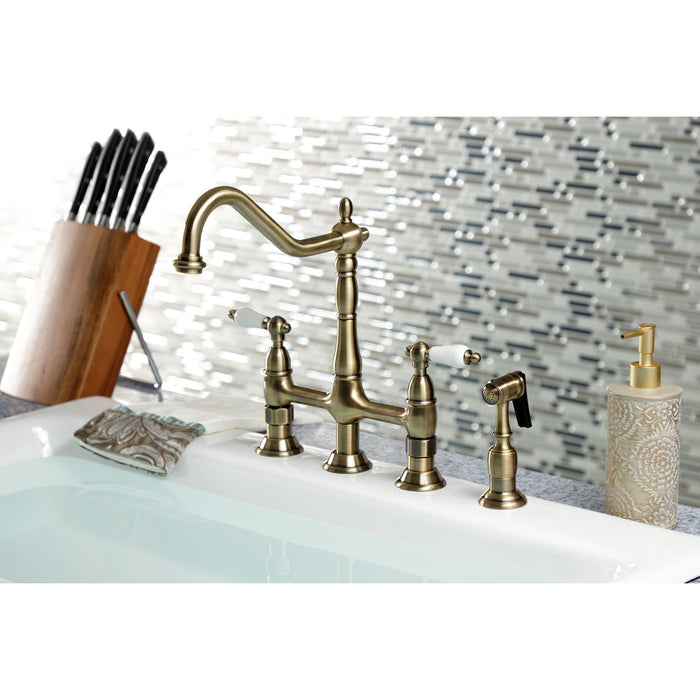 Kingston Heirloom KS1273PLBS - Heritage Two-Handle 4-Hole Deck Mount Bridge Kitchen Faucet with Brass Sprayer, Antique Brass