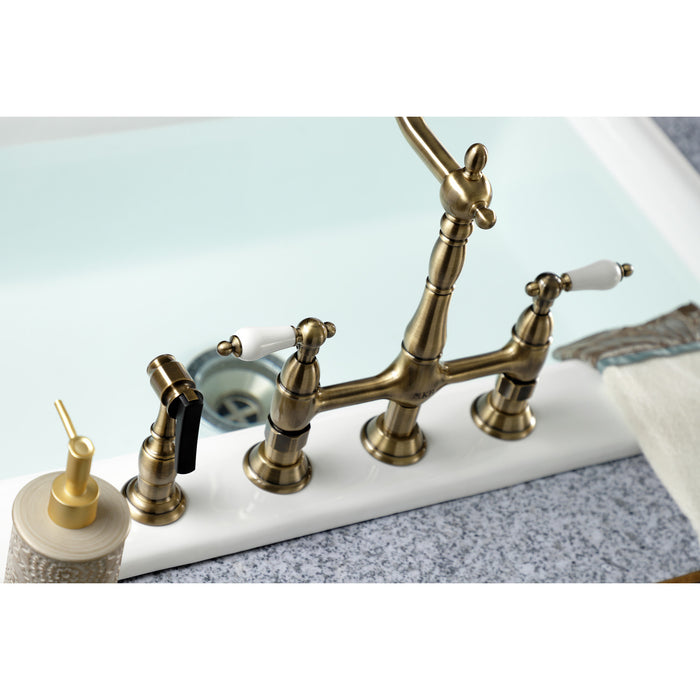 Kingston Heirloom KS1273PLBS - Heritage Two-Handle 4-Hole Deck Mount Bridge Kitchen Faucet with Brass Sprayer, Antique Brass