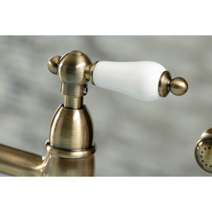 Kingston Heirloom KS1273PLBS - Heritage Two-Handle 4-Hole Deck Mount Bridge Kitchen Faucet with Brass Sprayer, Antique Brass