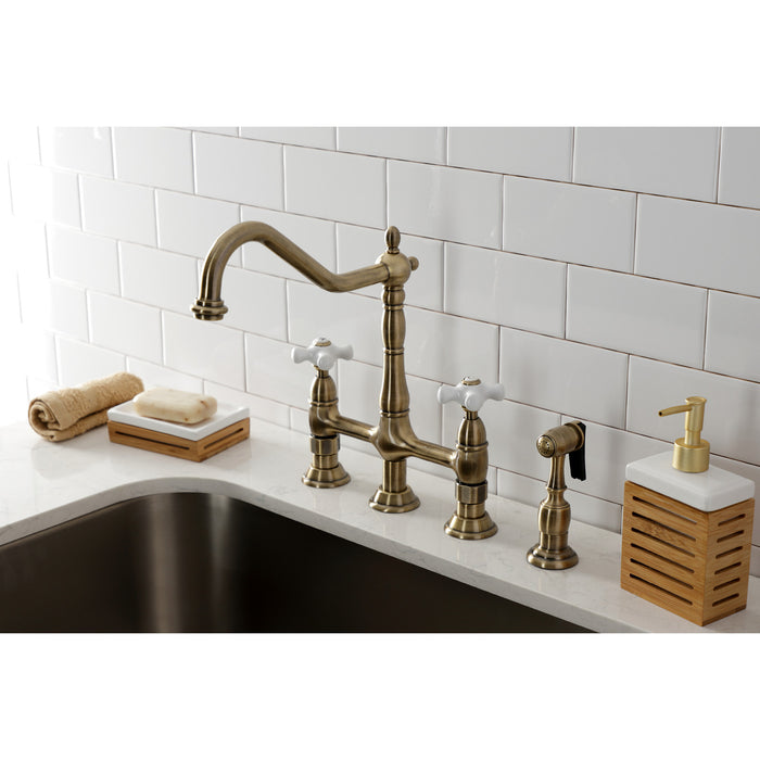 Kingston Heirloom KS1273PXBS - Heritage Two-Handle 4-Hole Deck Mount Bridge Kitchen Faucet with Brass Sprayer, Antique Brass
