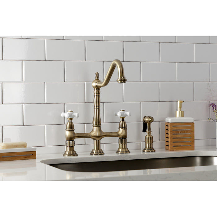 Kingston Heirloom KS1273PXBS - Heritage Two-Handle 4-Hole Deck Mount Bridge Kitchen Faucet with Brass Sprayer, Antique Brass