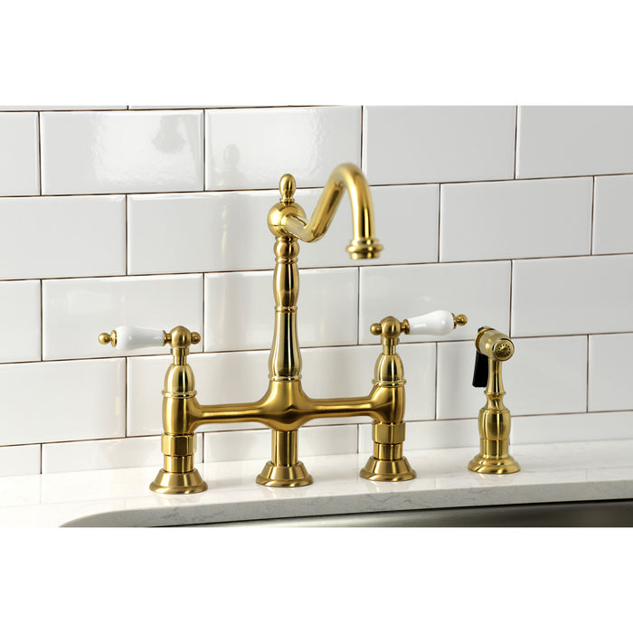 Kingston Heirloom KS1277PLBS - Heritage Two-Handle 4-Hole Deck Mount Bridge Kitchen Faucet with Brass Sprayer, Brushed Brass