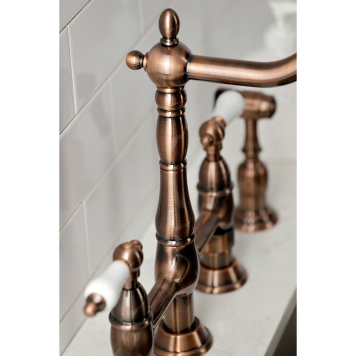 Kingston Heirloom KS127PLBSAC - Heritage Two-Handle 4-Hole Deck Mount Bridge Kitchen Faucet with Brass Sprayer, Antique Copper